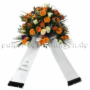 Orangenes Trauergesteck mit Gerbera und Rosen inkl. Schleife
