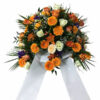 Orangenes Trauergesteck mit Gerbera und Rosen inkl. Schleife
